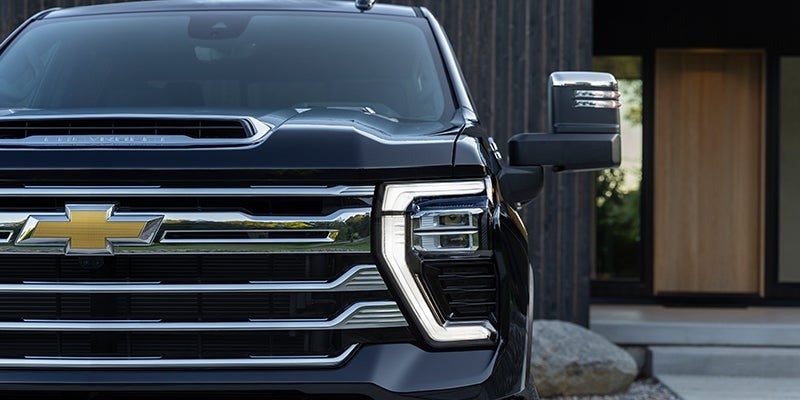 The front view of a black 2020 Chevrolet Silverado showcasing its sleek design and bold grille.