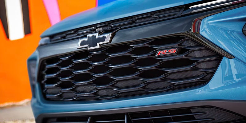Close-up of the blue Chevrolet Blazer's front grille, highlighting its bold styling and modern features.