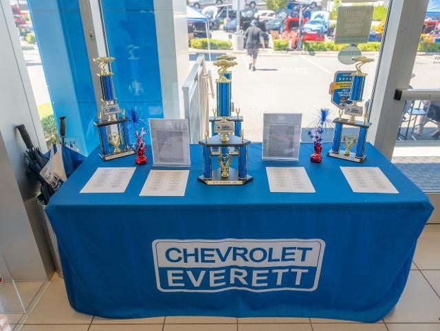 A table adorned with multiple trophies