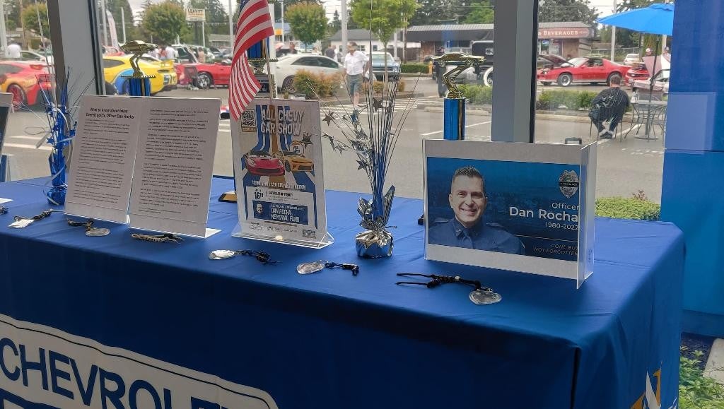 A table adorned with multiple objects, including a notable Chevrolet logo.