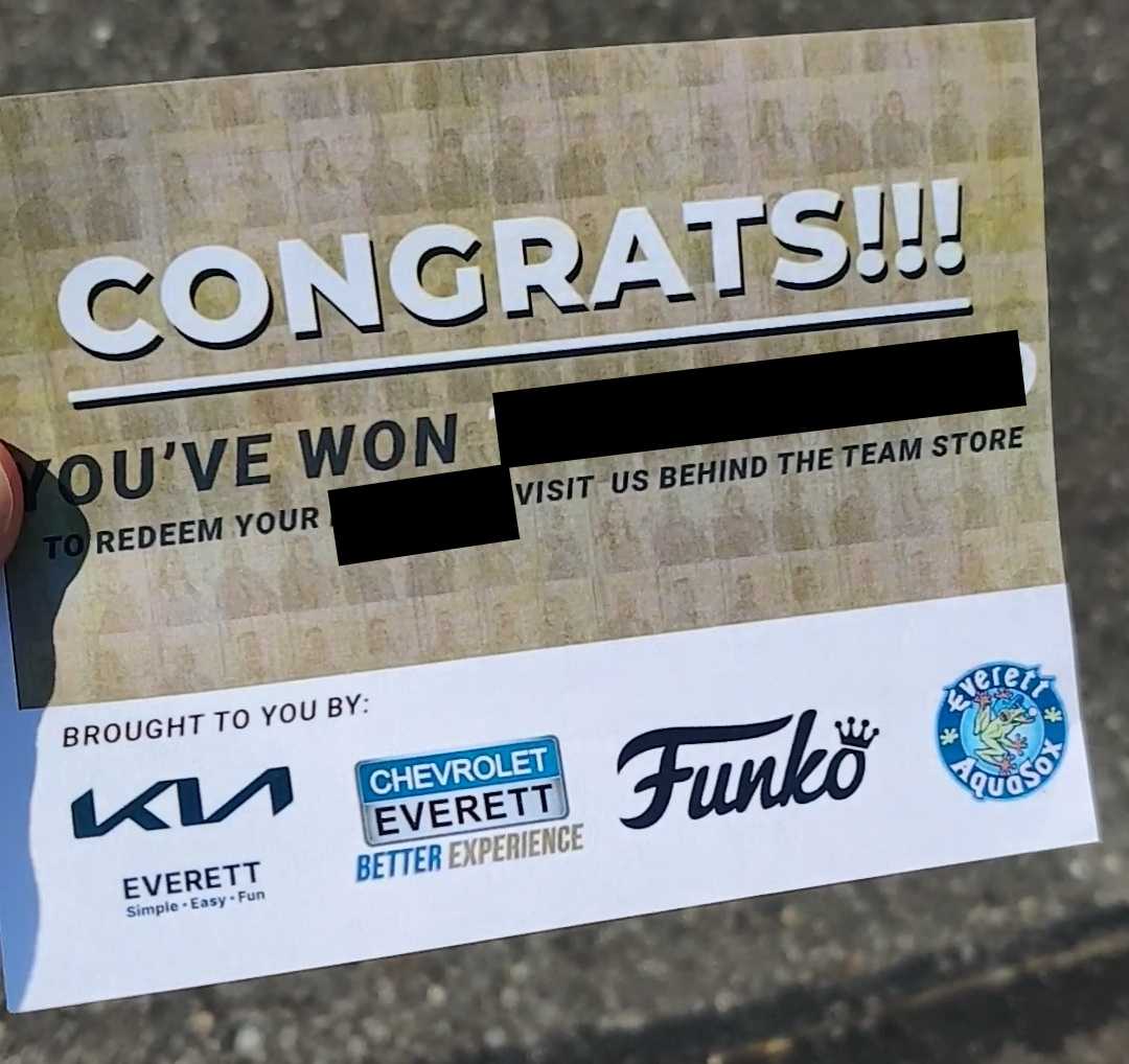 A prize redemption card with 'CONGRATS!!!' at the top, sponsor logos at the bottom, and some text redacted.